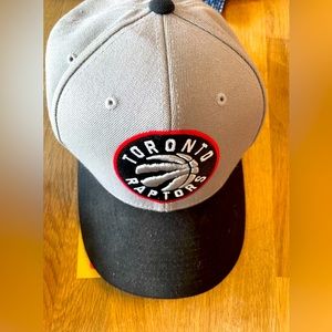 Mitchell and Ness Toronto Raptors NBA SnapBack Hat.